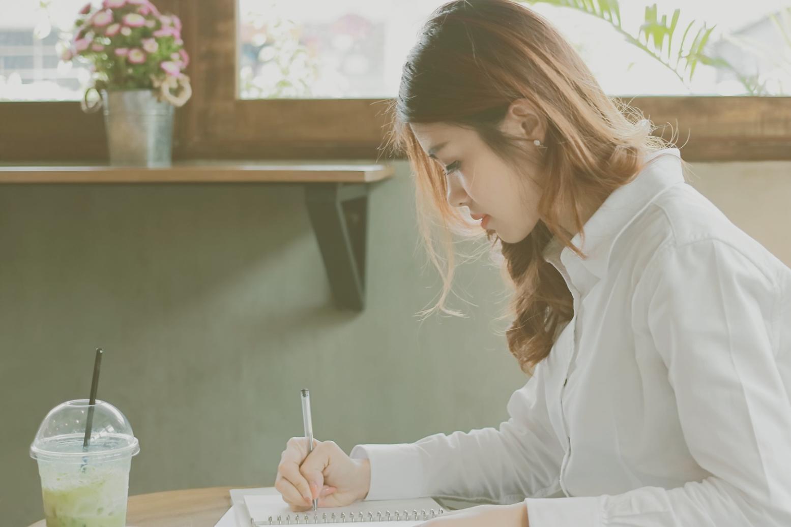 Photo composition workspace with camera equipment and learning materials